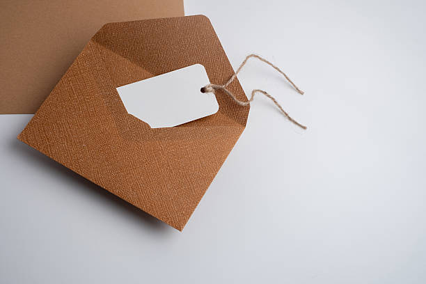 istock Paper envelopes on a light background. New mail, write a message. Send and receive mail. Postal delivery service. Empty envelope, empty space. Communication with people, paperwork. Envelope close-up 2219514580