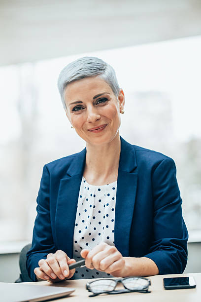 istock Confident Businesswoman in a Bright Office Setting 2219514870