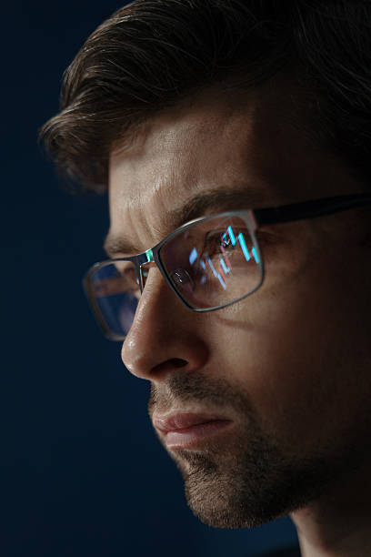 istock Close up of businessman analyzing trading data late at night 2219516897