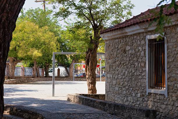 istock A quiet town square scene shows a stone building with a window 2219519066