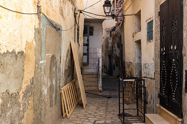 istock A narrow alleyway is lined with aging buildings 2219519461