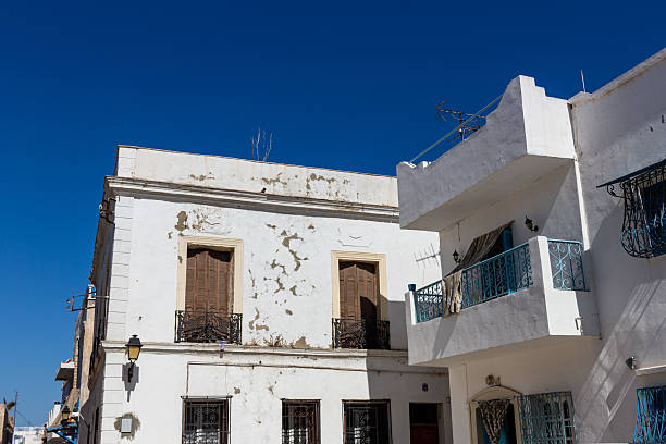 istock White buildings stand against a vibrant blue sky. 2219519950