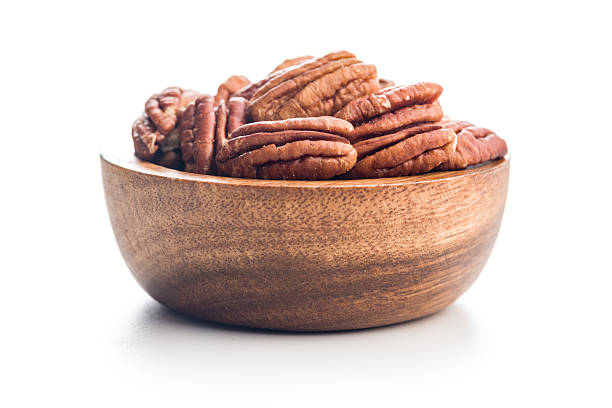 Whole and shelled pecan nuts isolated on white, with copy space