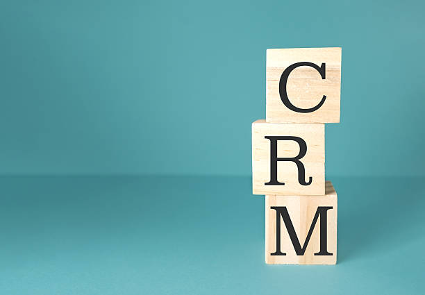 istock Stack of wooden blocks with the letters CRM on top 2219525479