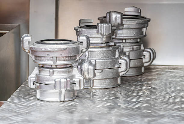 istock Stack of metallic rescue equipment in industrial setting, reflective chrome-like objects with varying orientations, possibly stainless steel or alloy, even lighting casting soft shadows 2219532725