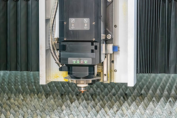 istock Close-up view of an industrial machinery in operation, processing a metallic surface Machine features a mechanical arm and circular drillingcutting tool Setting suggests an industrial environment 2219532859