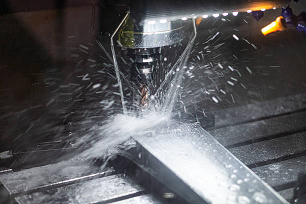 istock Industrial machine spraying liquid in a workshop setting Grayscale color palette with white droplets Artificial lighting casting shadows No human presence 2219532869