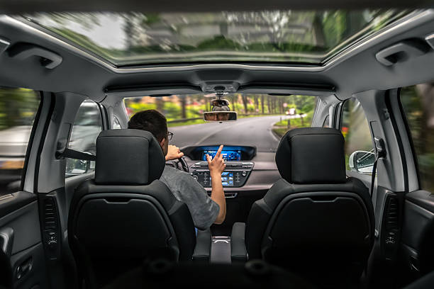 Driver in motion. Car ride through forest road. Driving with dynamic blur.