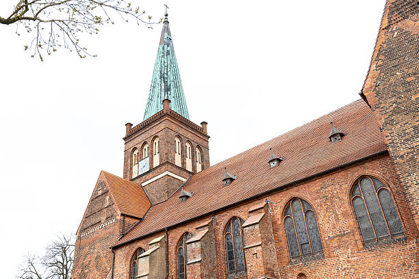 istock Medieval church. Brick gothic. Tower spire. 2219536723