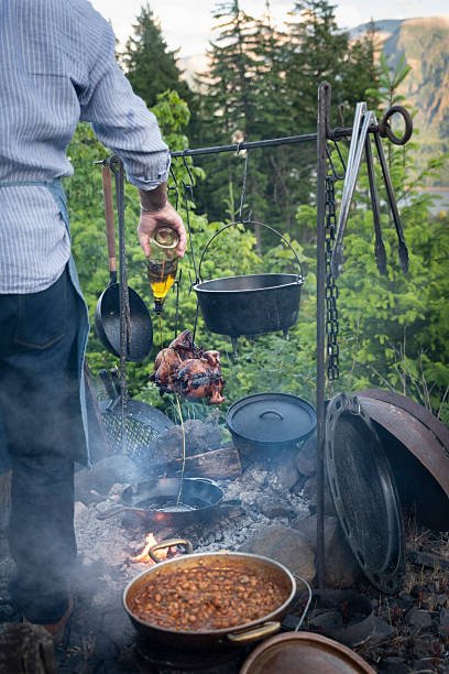 istock Open-fire Chef Adding Olive Oil to a Skillet 2219544615