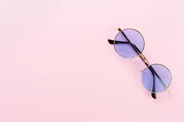 istock Blue sunglasses on color background, top view 2219547806