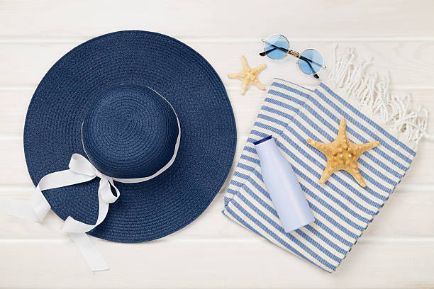 istock Blue beach accessories on wooden background, top view. Flat lay 2219547808