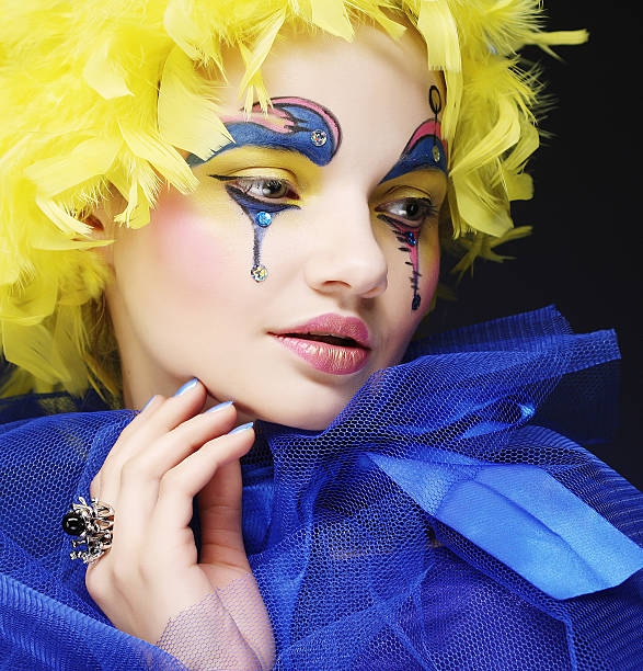 Young woman with yellow wig feather. Holiday theme.