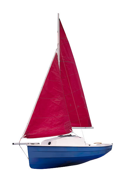 istock Training sailboat with red sails isolated on white background 2219549021