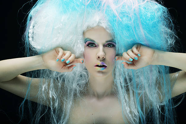 istock young woman with bright make up and creative hair 2219549664