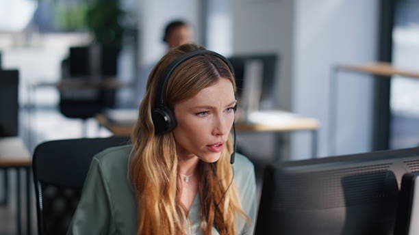 istock Sales agent talking headphones sitting office closeup. Professional operator 2219550110