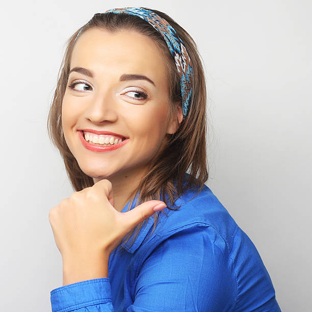 Beautiful young surprised woman. Studio shot.