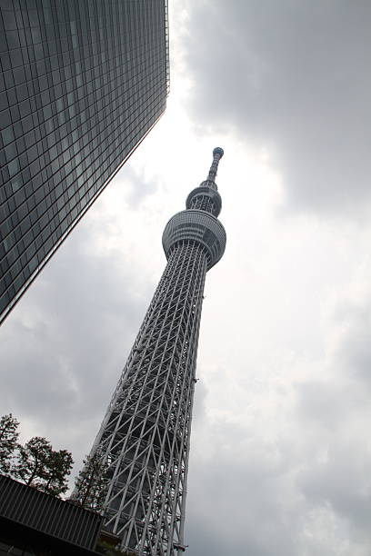 The Tokyo Skytree rises dramatically into the sky, a sleek and modern marvel of engineering that dominates the city skyline. Its slender, tapering form and lattice-like structure combine cutting-edge technology with elegant design, making it a standout landmark in Tokyo. Clad in soft blue-gray tones, the Skytree reflects light throughout the day, offering different visual impressions depending on the weather and time. As the tallest structure in Japan, its silhouette is visible from across the city, symbolizing Tokyo’s blend of innovation, resilience, and architectural ambition.