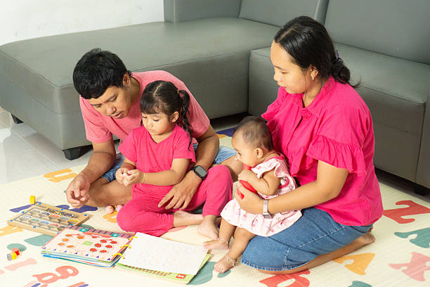 istock Parents and Children Learning Together at Home 2219555162