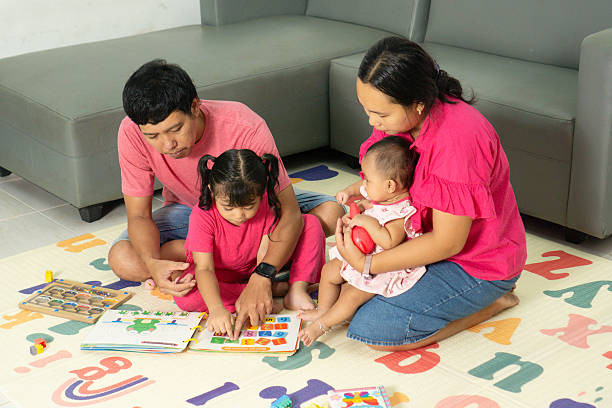 istock Family Learning Time with Toddlers on the Floor 2219555195