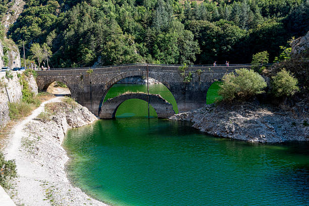 istock Arched Stone Bridge over Lake San Domenico, Abruzzo 2219555798