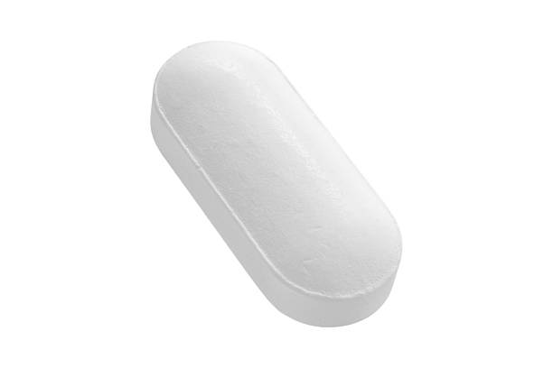 istock White medicine pill tablet isolated on white background 2219556379