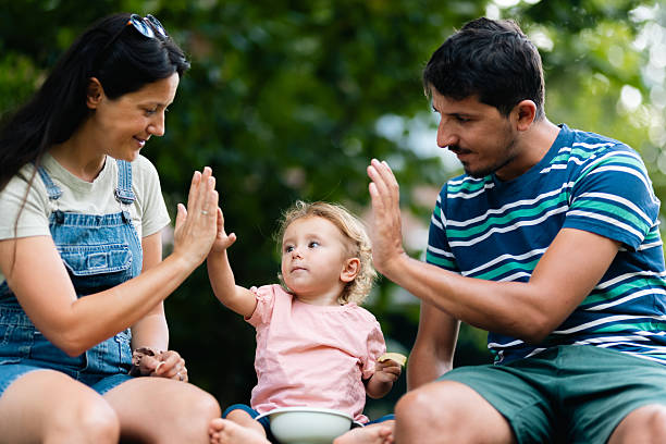 istock Parents Spending Quality Time Engaging with Their Child in a Park 2219556442
