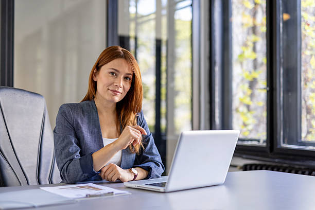 istock Confident young woman working at a modern office space 2219556630