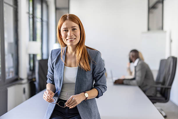 istock Confident businesswoman posing in bright office setting 2219556635