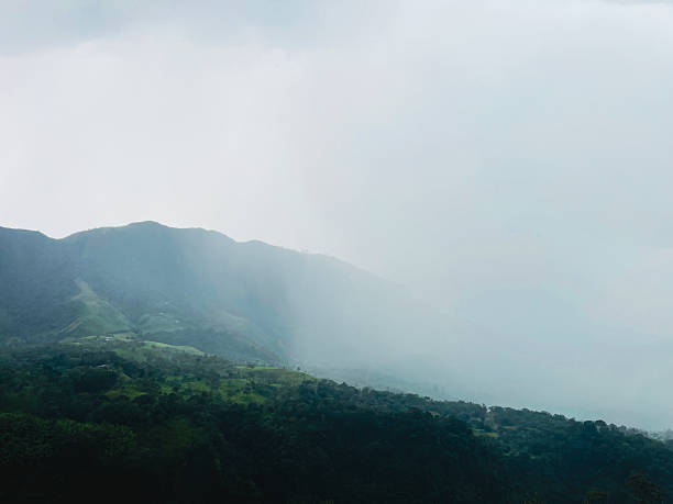 istock Rainy cloud rolling over tropical hills in the mountains, Colombia 2219567192
