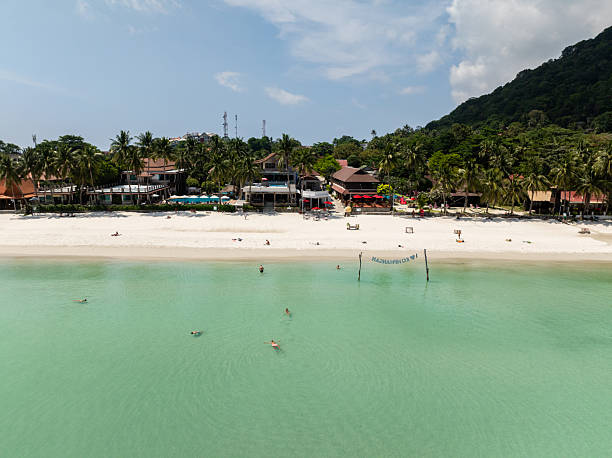 istock Beachfront resorts along turquoise waters and sandy shore. Ko Pha Ngan, Thailand. 2219567225