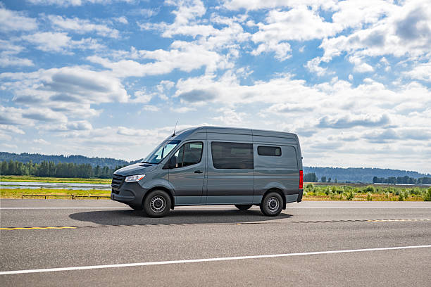 istock Gray commercial cargo mini van running on the highway road making customer delivery 2219567864