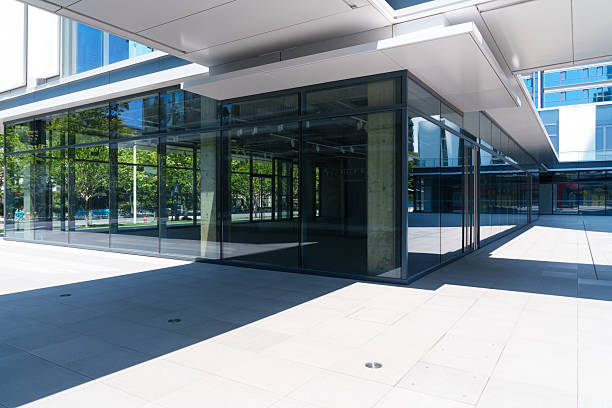 istock modern office building with street in city 2219568020