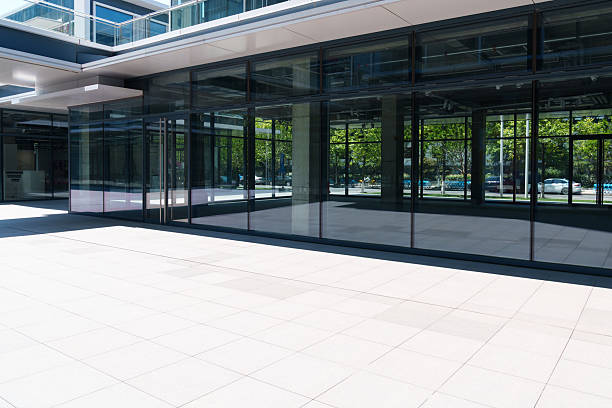 istock modern office building with street in city 2219568047