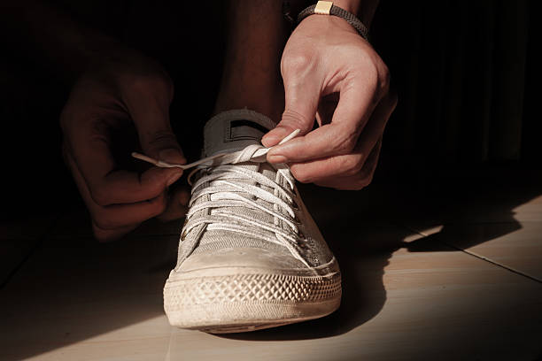 istock Tying Shoelaces Before Starting the Morning Routine 2219569608
