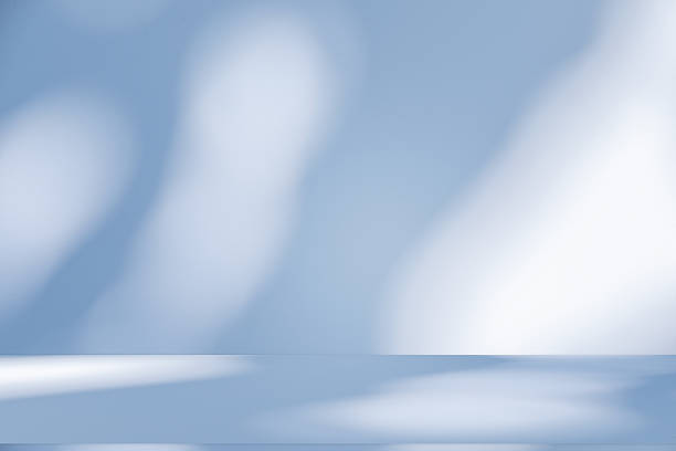 istock Studio style background wall decoration presentation uses white and blue tones. with shadows cast from a nearby window, concept creating a decorative 2219570921