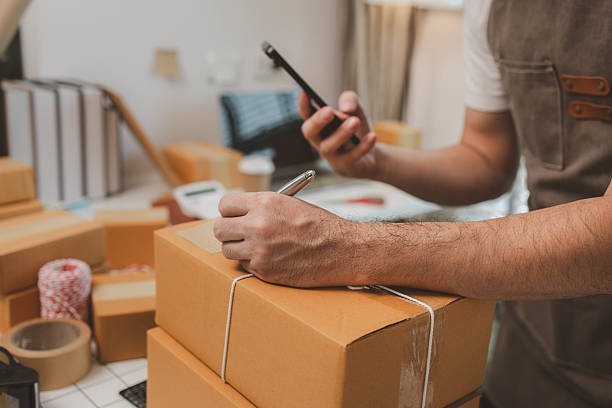 istock he is checking the boxes in the packing room, a small business owner is preparing boxes to ship to customers, product, e-business, entrepreneurs in online sales and export businesses 2219574020