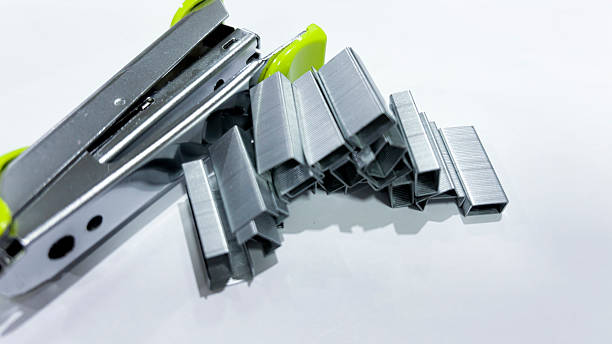 istock Silver Stapler with Metal Staples on White Background 2219574681