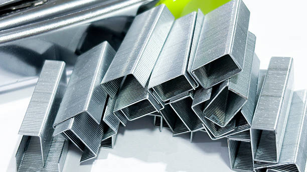 istock Close-up of Silver Staples on White Background 2219574733