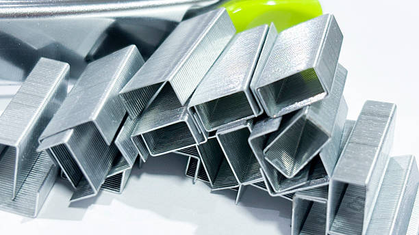istock Close-up of Silver Staples on White Background 2219574757