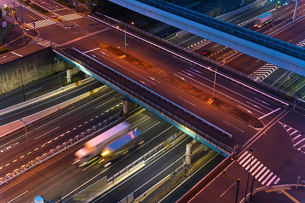 istock Glowing lights trace highway ramps and bridges at Tokyo waterfront intersection 2219574776