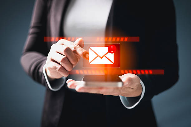 istock Phishing email alert concept with person using smartphone while surrounded by warning icons symbolizing scam messages cyber threats digital communication security risks. electronic mail alert phishing 2219576149
