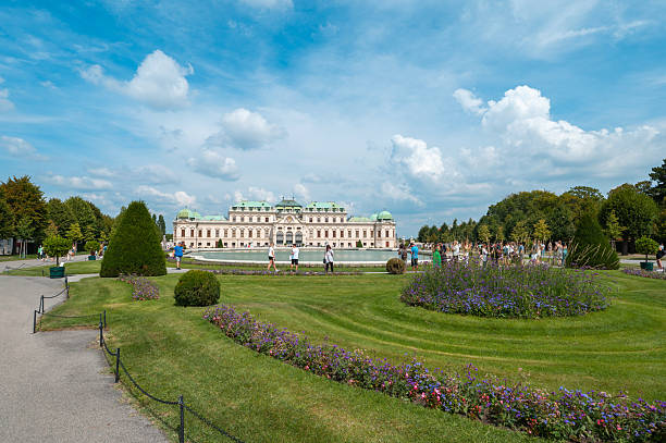 Silhouette of a young woman filming in front of the parliament in Vienna,The historic building of the Austrian Parliament in Vienna