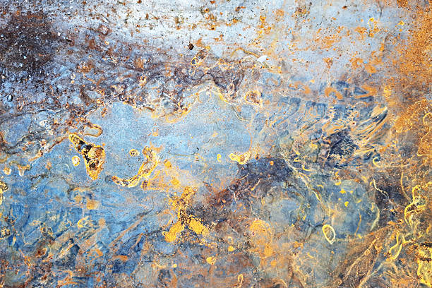 istock Abstract rusty metal surface. Multicolored oxidized steel with intense corrosion. Texture of decaying material. 2219578488