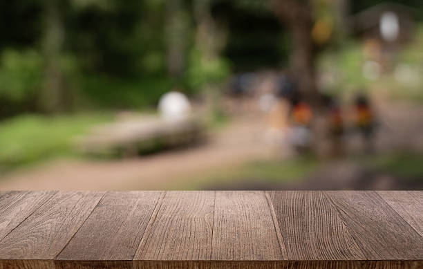 istock Empty wood table top and blur of restaurant background selective focus product display 2219579127