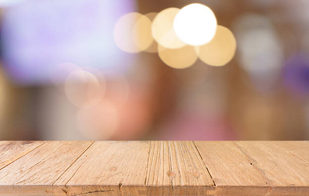 istock Empty wood table top and blur of restaurant background selective focus product display 2219579132