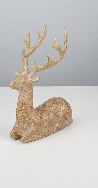 istock Christmas reindeer sitting isolated nature background with clipping path 2219581666