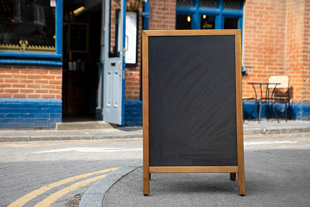 istock A-frame chalkboard sign on a pavement outside a pub with copy space 2219595017