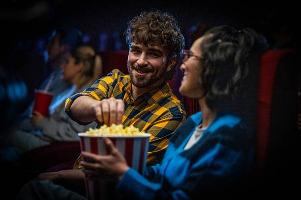 istock Joyful Moviegoers Savor Popcorn in Theaters 2219604882