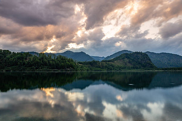istock Tranquil Reflections of Clouds and Mountains at Almsee Lake during Sunset, Austria 2219606350